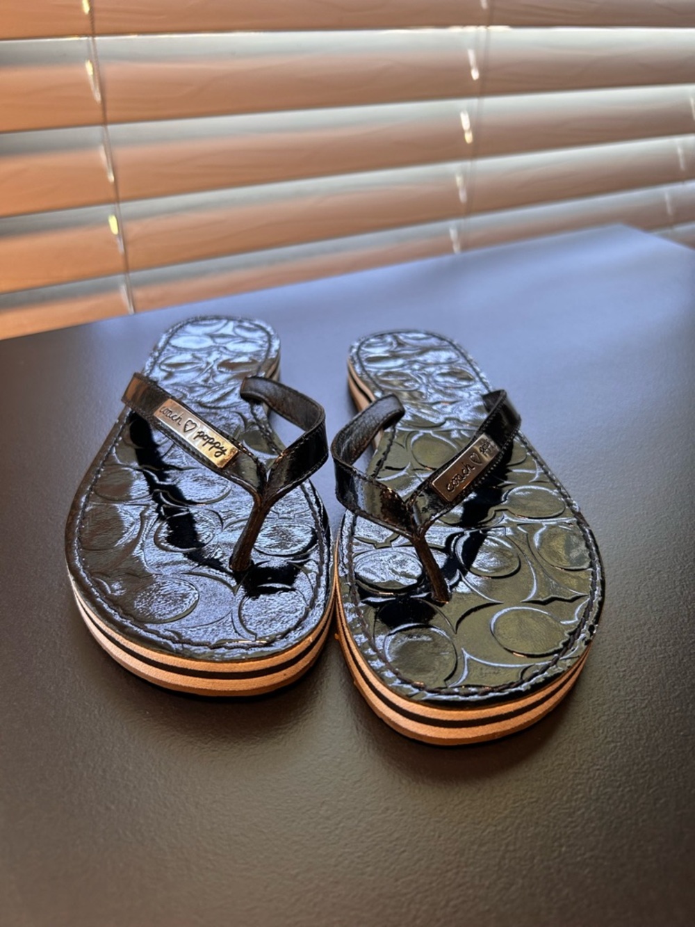 Coach ♡ Poppy patent leather sandals, signature embossed pattern, logo plaque.